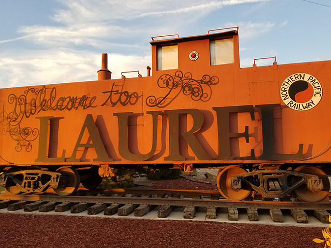Welcome to Laurel sign in the shape of a caboose. By: bnsf.com