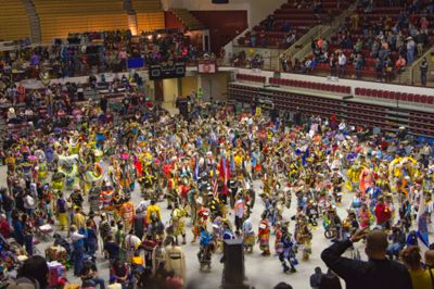 Native American dancers, coming into Washington Grizzly Stadium during the pow wow grand entry.